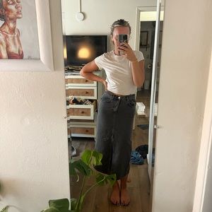 Black denim midi skirt with slit in the middle